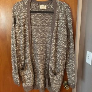 A grey and white cardigan!